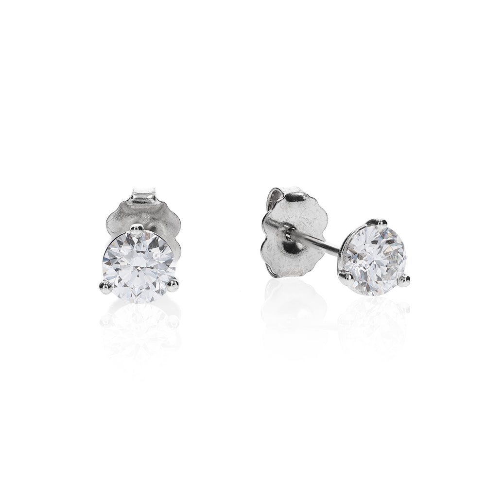 White gold 3 prong martini set diamond studs on a white background