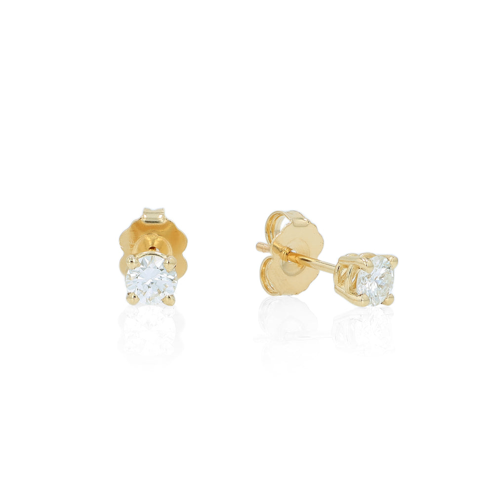 Yellow gold 4 prong diamond stud earrings on a white background