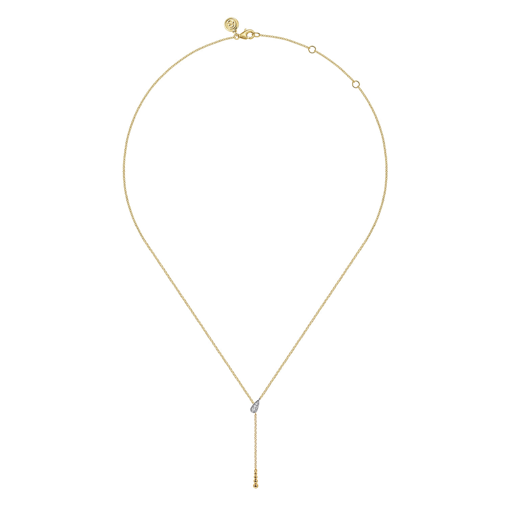 gold necklace on white background