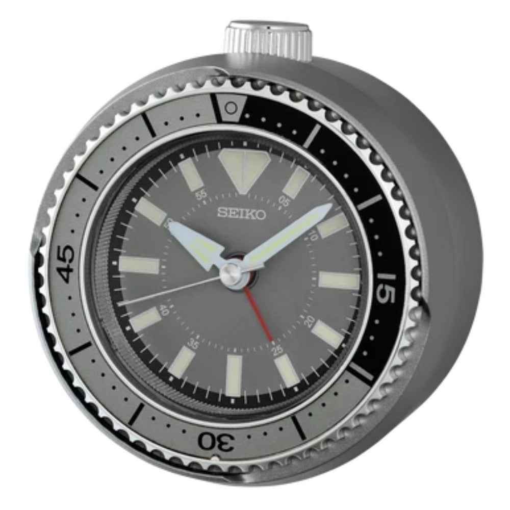 silver tone alarm clock on a white background