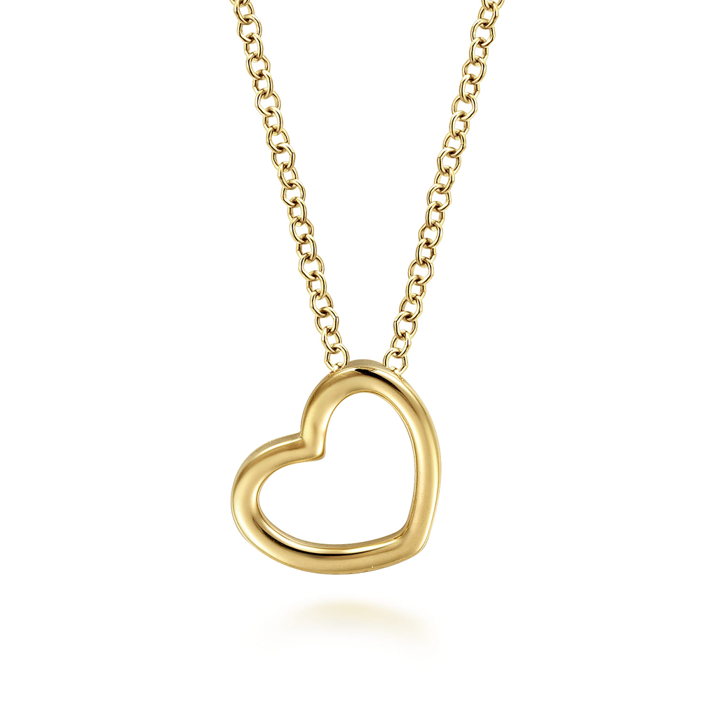 Gold heart-shaped necklace on a white background