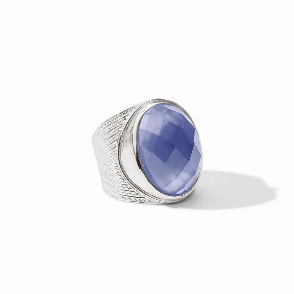 Silver ring with a blue gemstone on a white background