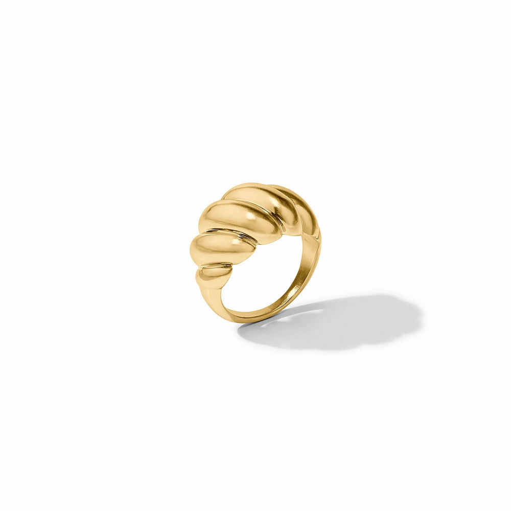 Gold ring with a textured design on a white background