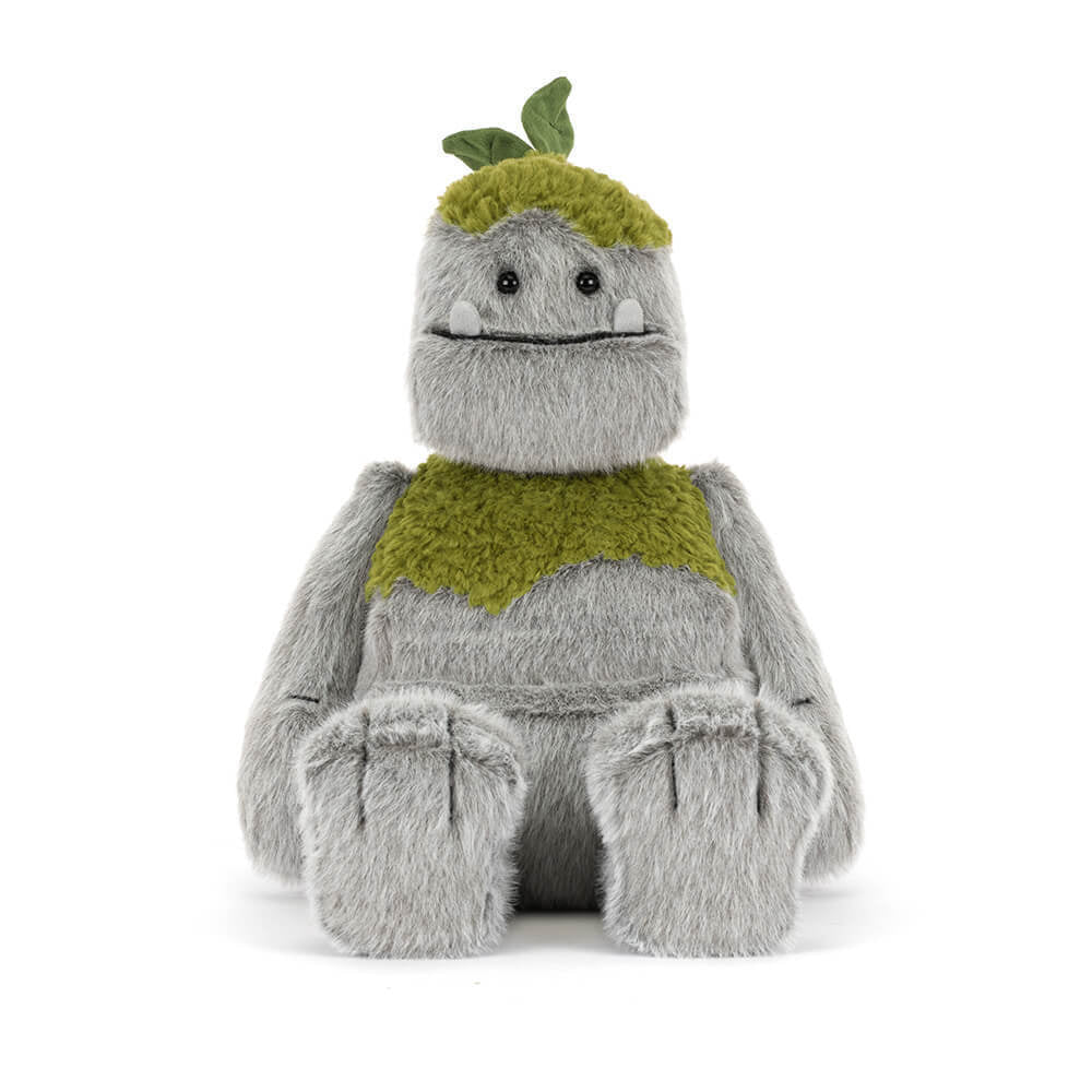 A front photo of a grey & green Rocketon plush toy creature on a white background.