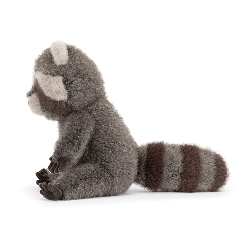 A side photo of a grey stuffed raccoon on a white background.