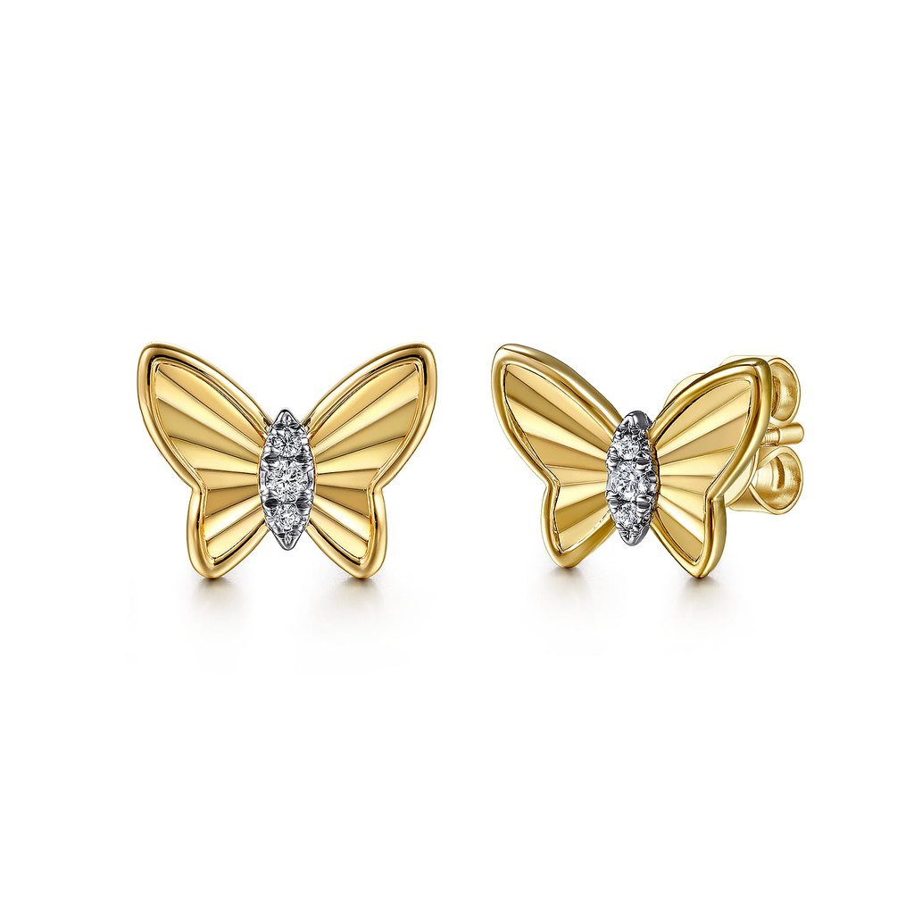 Gold butterfly earrings with diamond accents on a white background