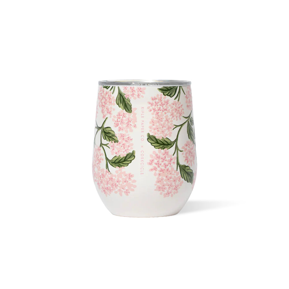 Pink cream colored stemless tumbler with a pink hydrangea floral design on a white background.