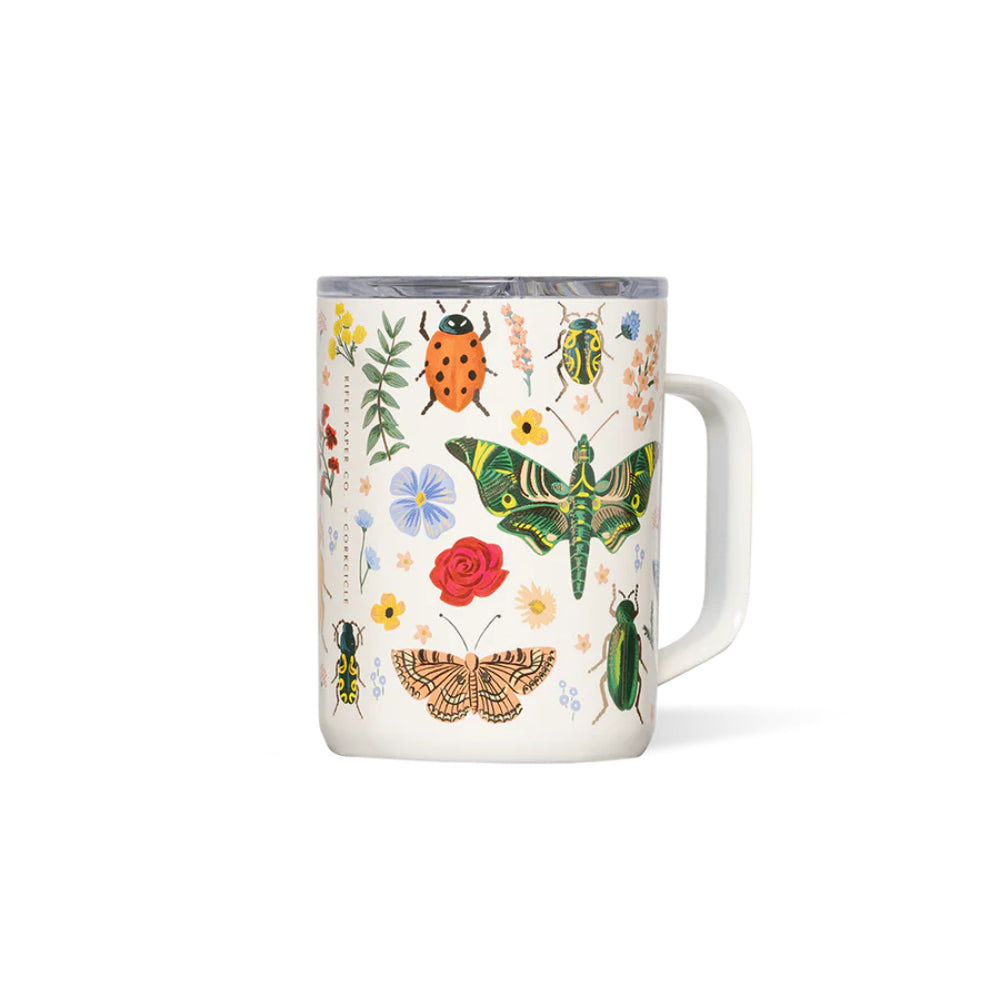 White mug with colorful insect and floral design on a white background.