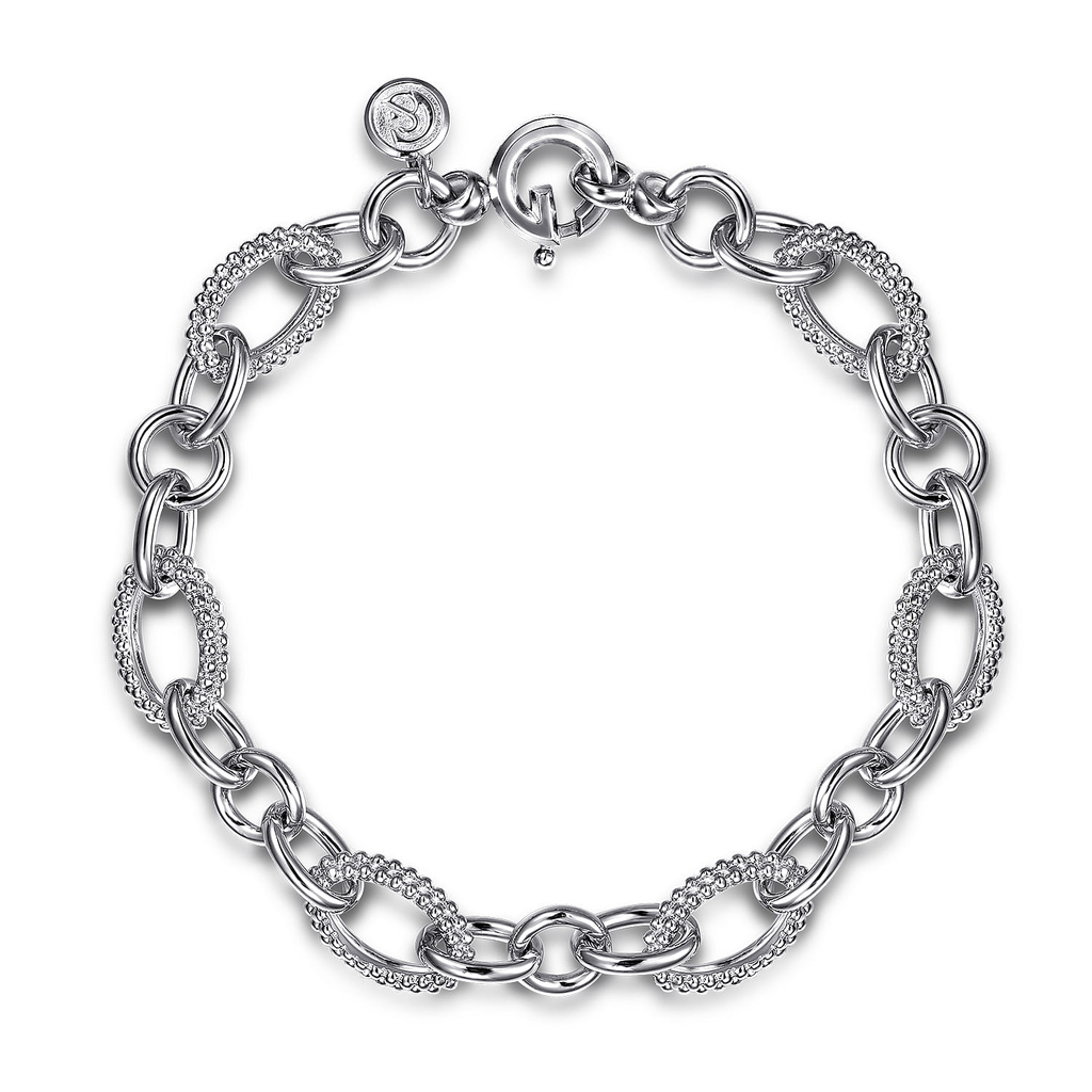 silver round link bracelet on white background