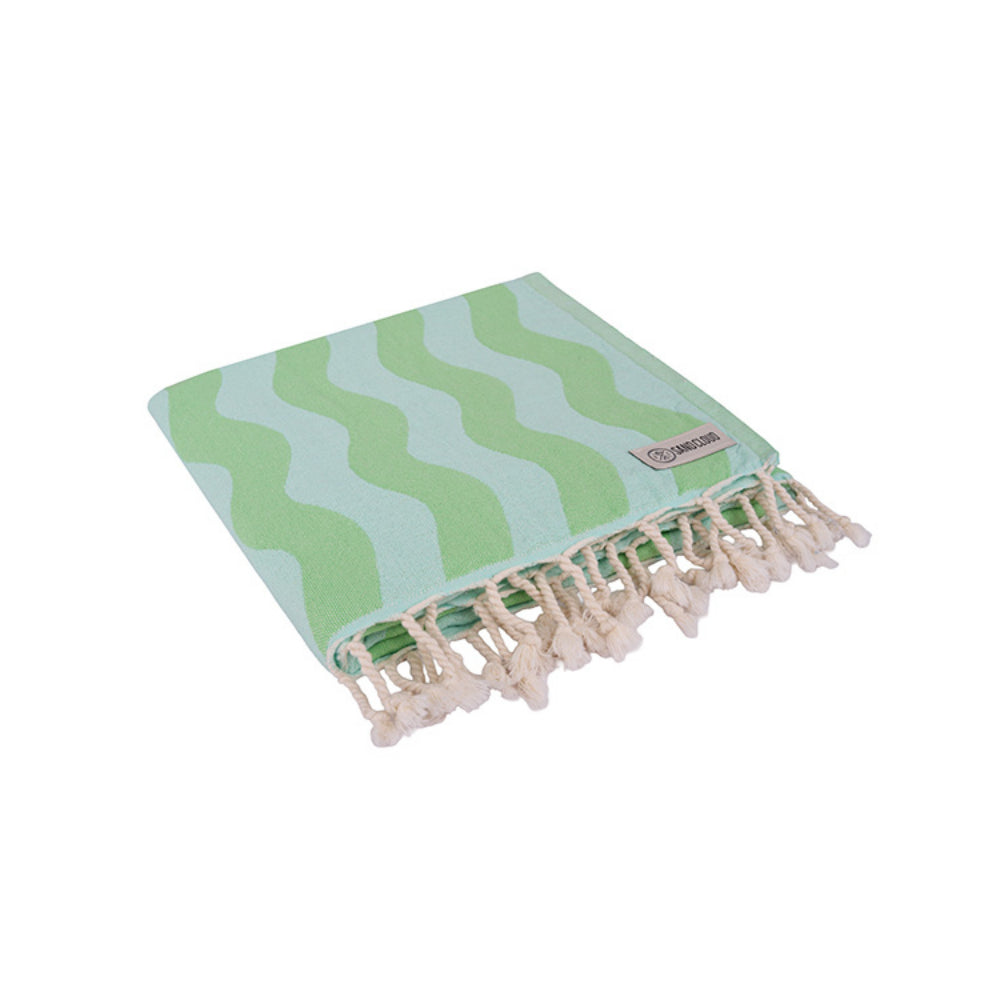Folded lime green & blue wavy striped beach towel with white tassel edge on a white background.