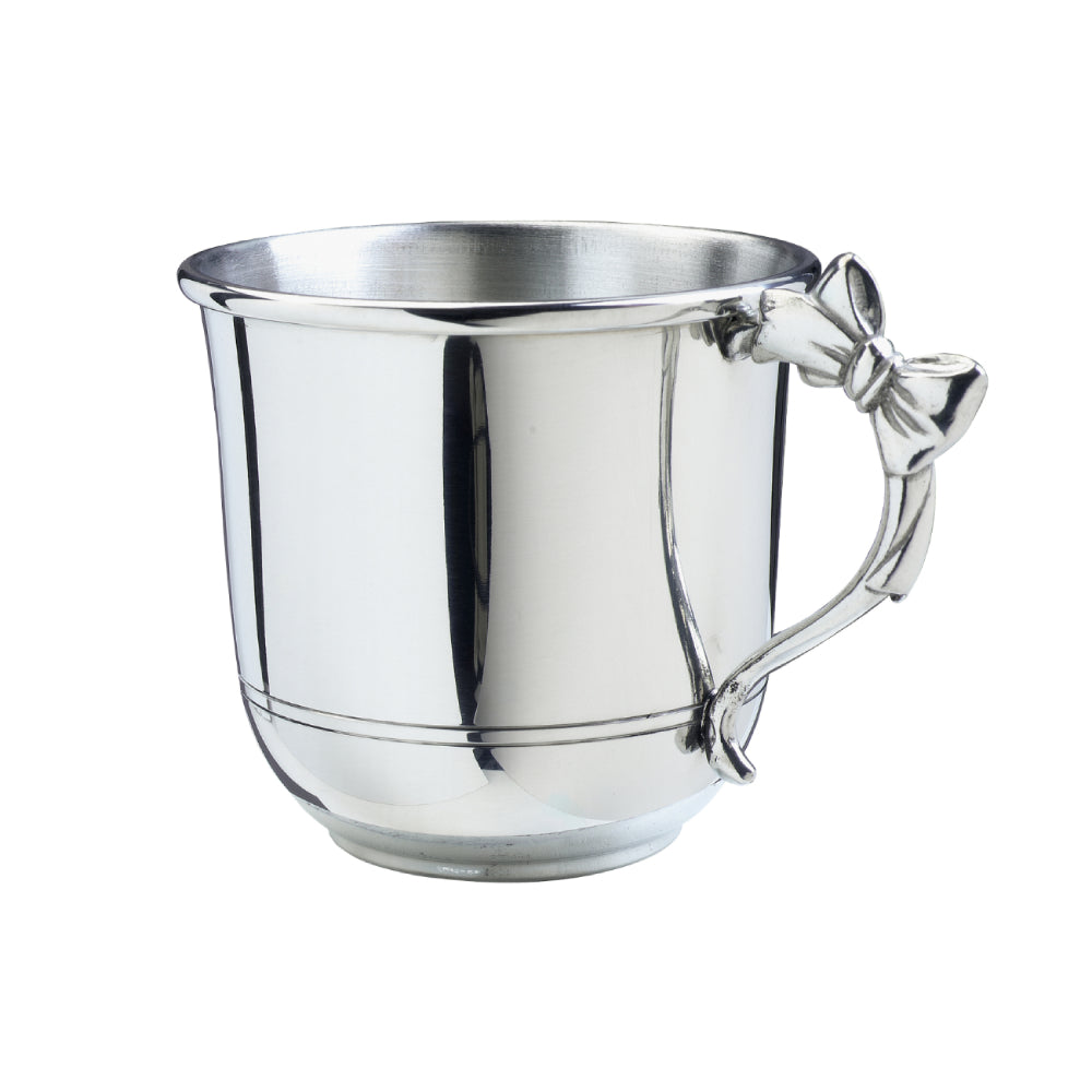 Silver baby cup with a bow on handle on a white background.