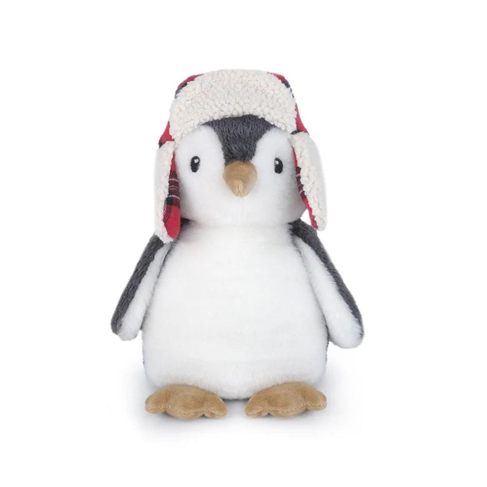 A plush penguin toy wearing a cream-colored trapper hat with red and black plaid ear flaps, set against a plain white background.