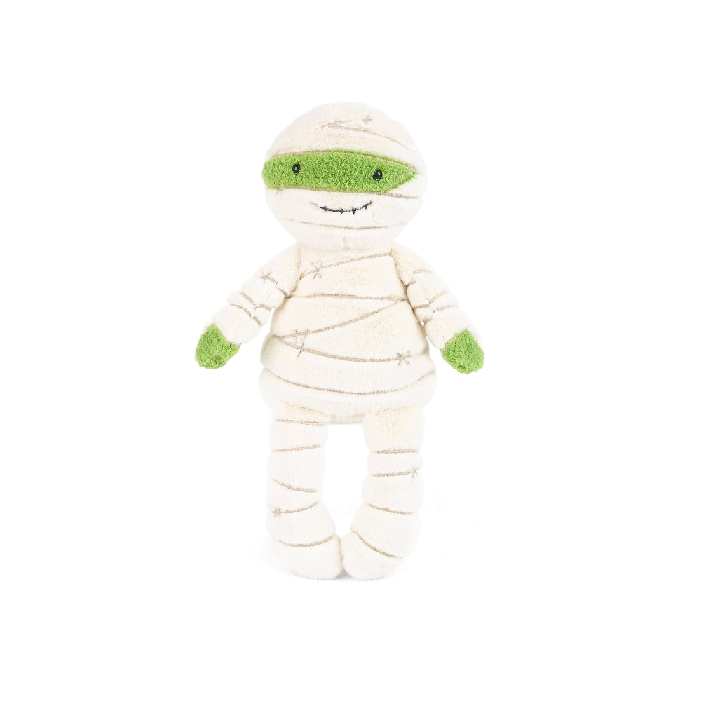 Toy mummy with green eyes on a white background