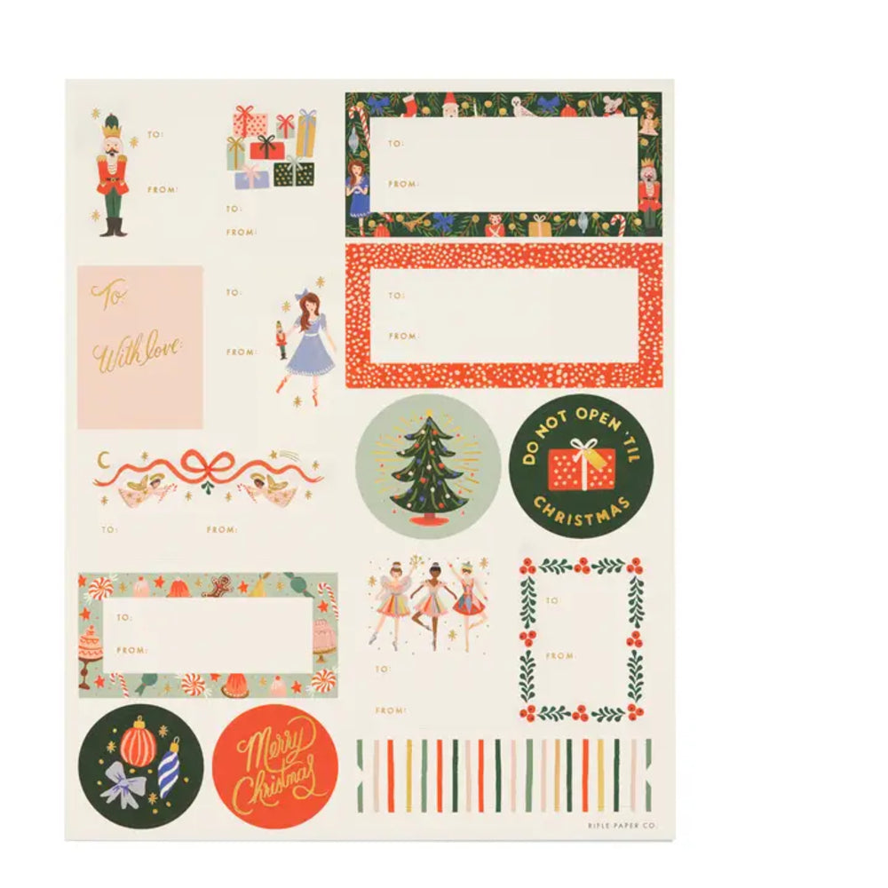 A sheet of Christmas-themed paper labels and stickers from Kildare Paper Co., featuring festive patterns, holiday greetings, and decorative frames on a white background.