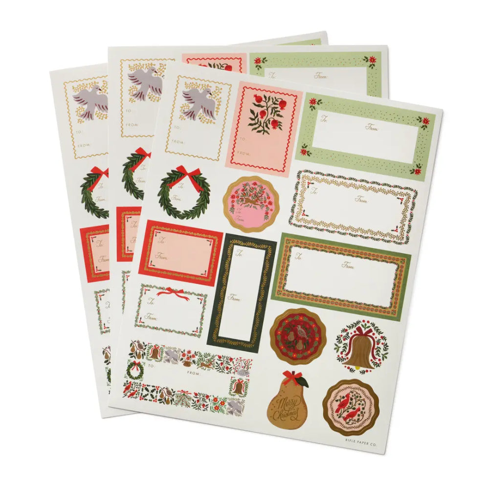 A set of Christmas-themed sticker sheets with various festive labels, borders, wreaths, ornaments, and food illustrations in red, green, gold, and pink tones, displayed on a clean white background.