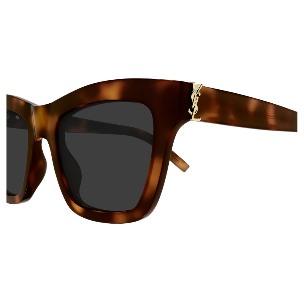 Sunglasses with tortoiseshell frame and dark lenses on a white background