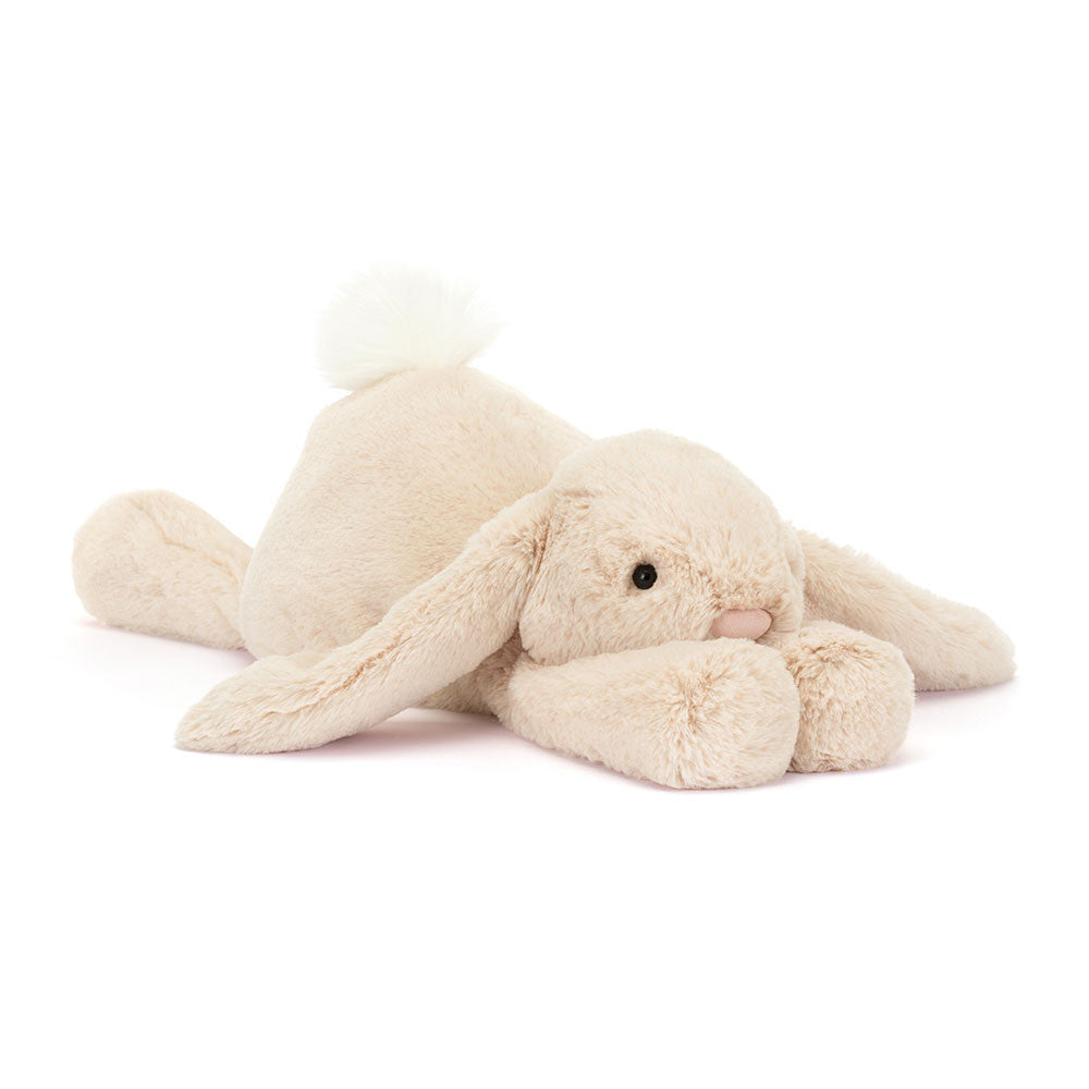 Big size beige plush bunny toy on a white background.