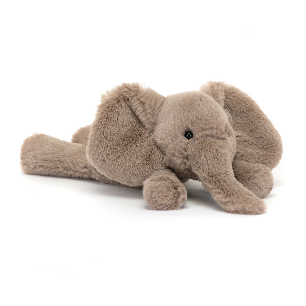 A tiny sized plush toy elephant with soft grey-brown fur, big black eyes, and large ears.