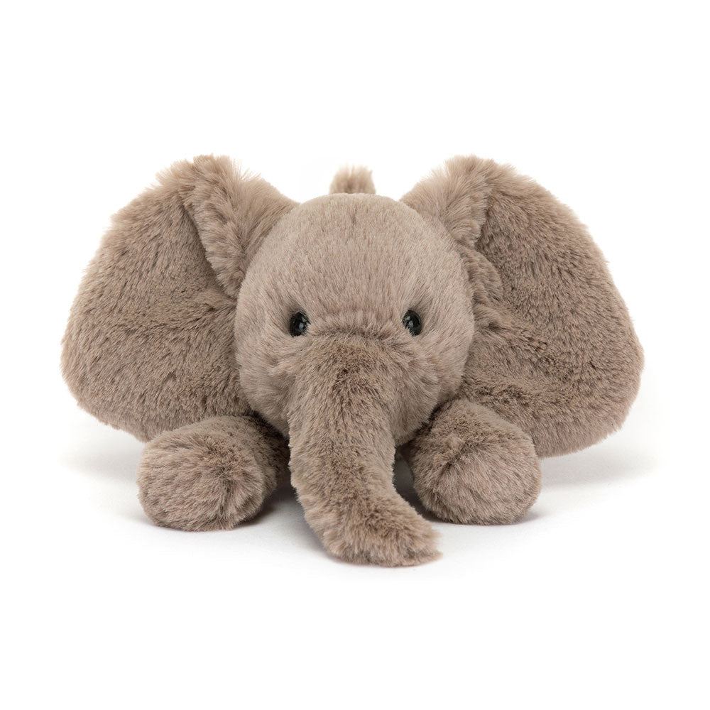 A photo of the front  of a tiny sized plush toy elephant with soft grey-brown fur, big black eyes, and large ears.