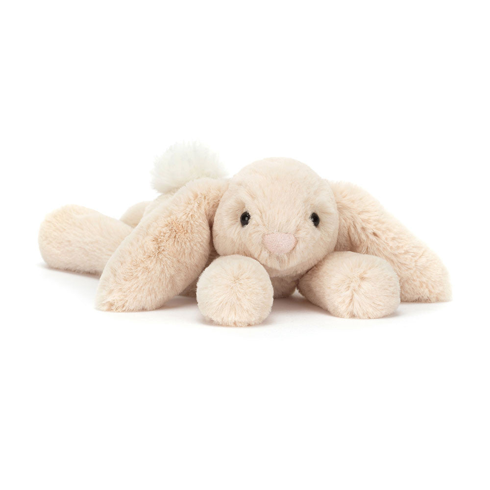 Tiny size beige plush bunny toy on a white background.