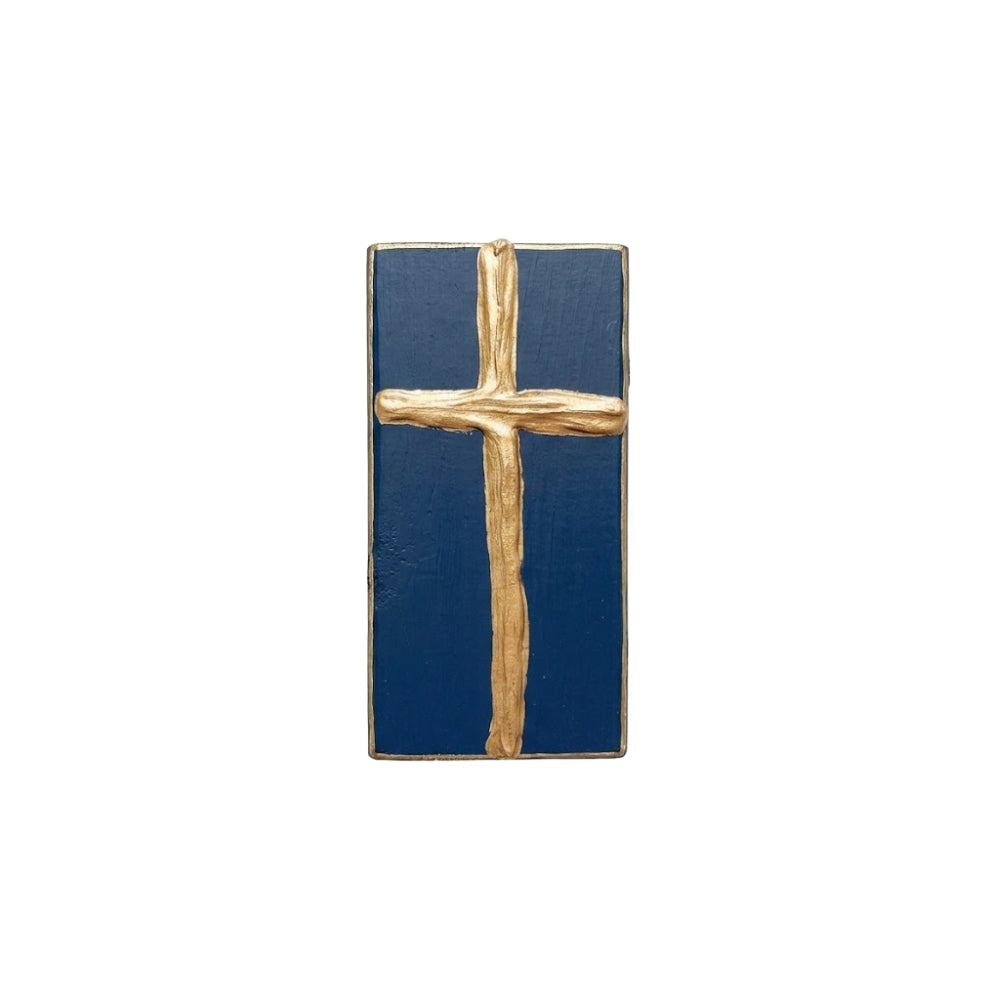 Gold cross decorative navy blue painted wooden block on a white background