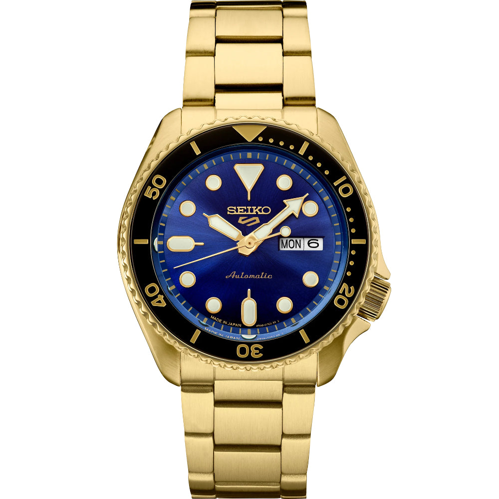 Gold Seiko watch with blue dial on a white background