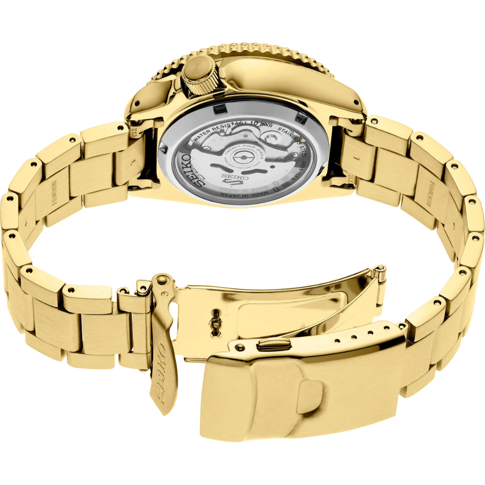 Gold watch with mechanical components on a white background
