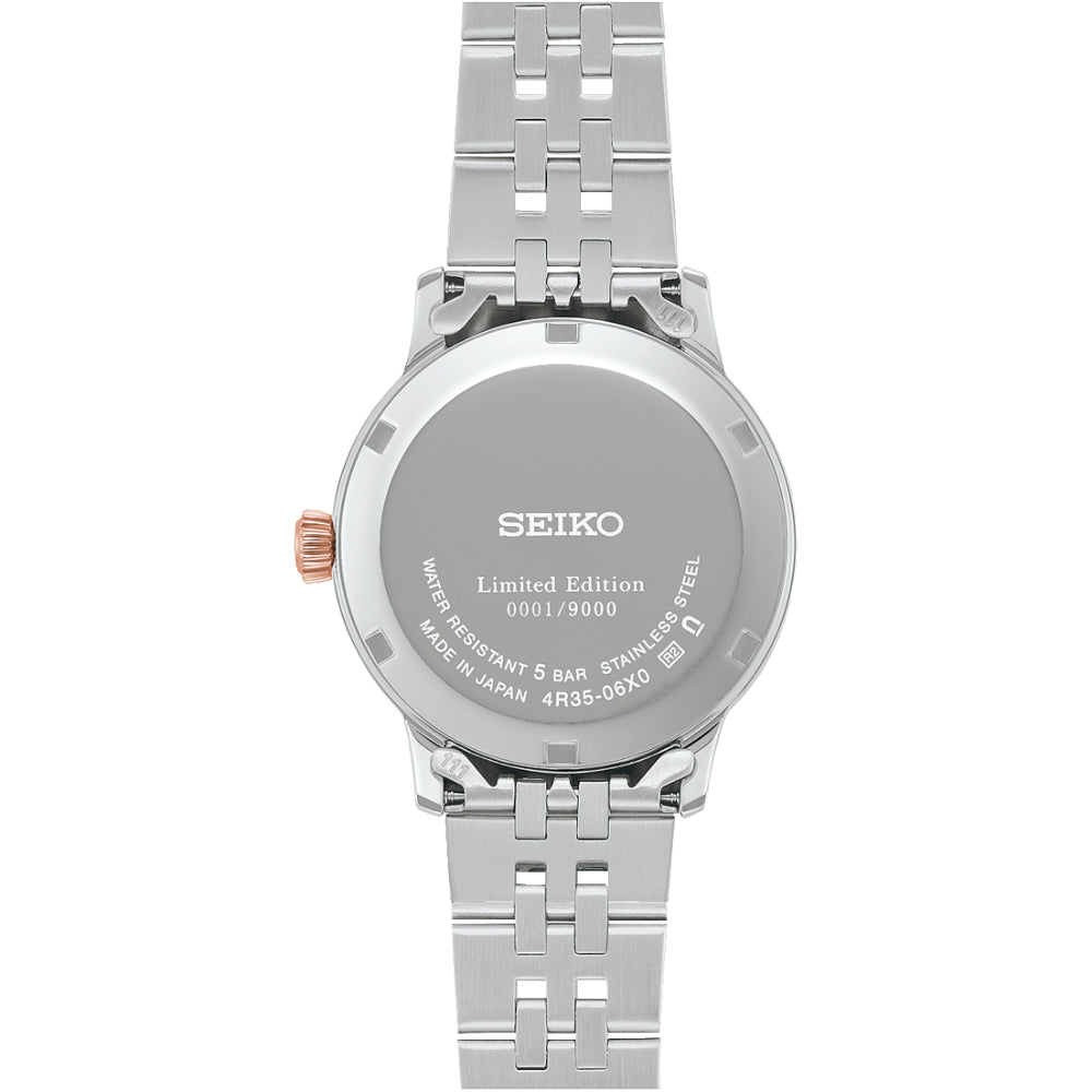 Two-Tone Watch with Pink Dial on a White Background