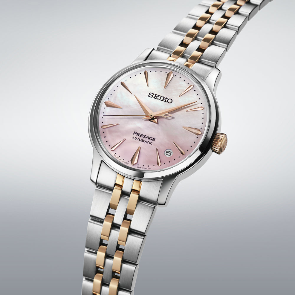 Two-Tone Watch with Pink Dial on a White Background