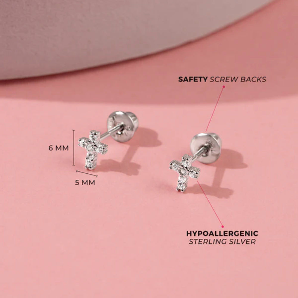Hypoallergenic sterling silver earrings with safety screw backs on a pink background
