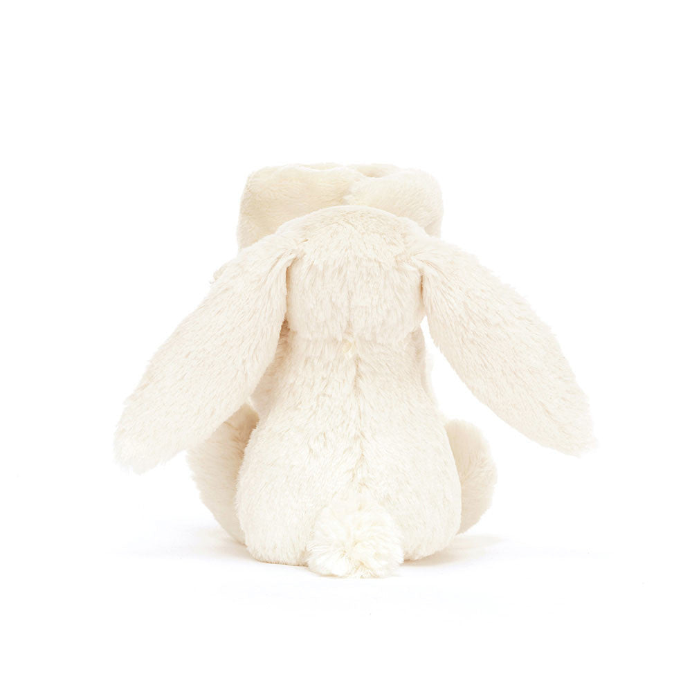Back of a white plush bunny toy on a white background.