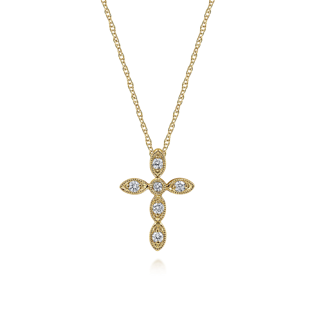 Gold cross necklace with diamonds on a white background