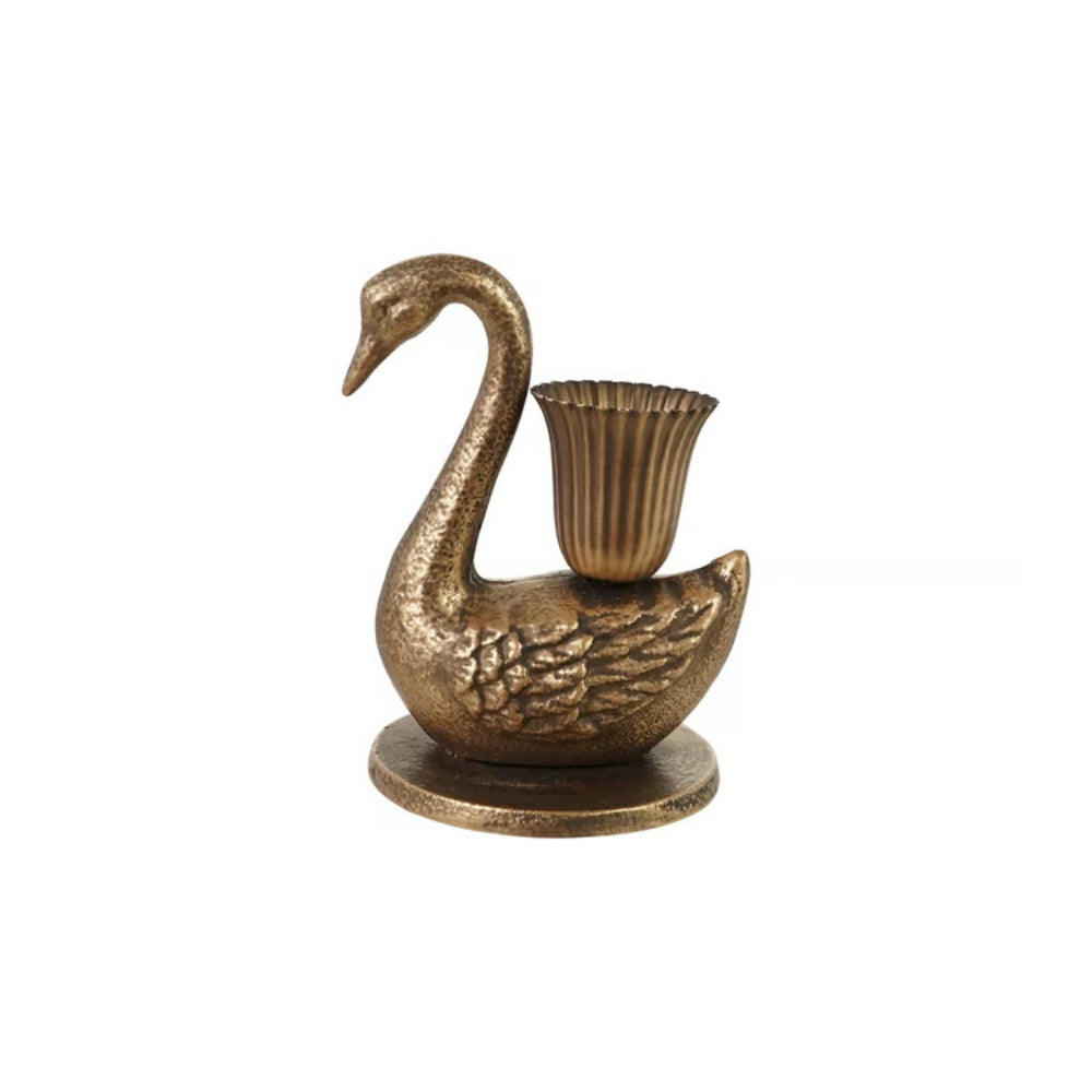A small swan-shaped brass candle holder with a fluted cup on its back, set against a plain white background.