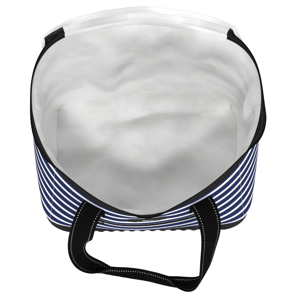 A soft cooler with navy blue and white horizontal stripes, featuring black straps and a reinforced bottom, including the interior of the soft cooler, white inside. 