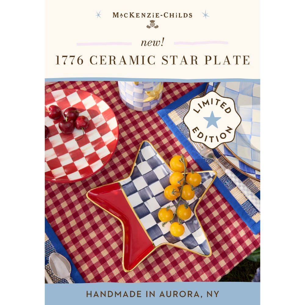 Advertisement for a ceramic star plate by MacKenzie-Childs on a checkered tablecloth.