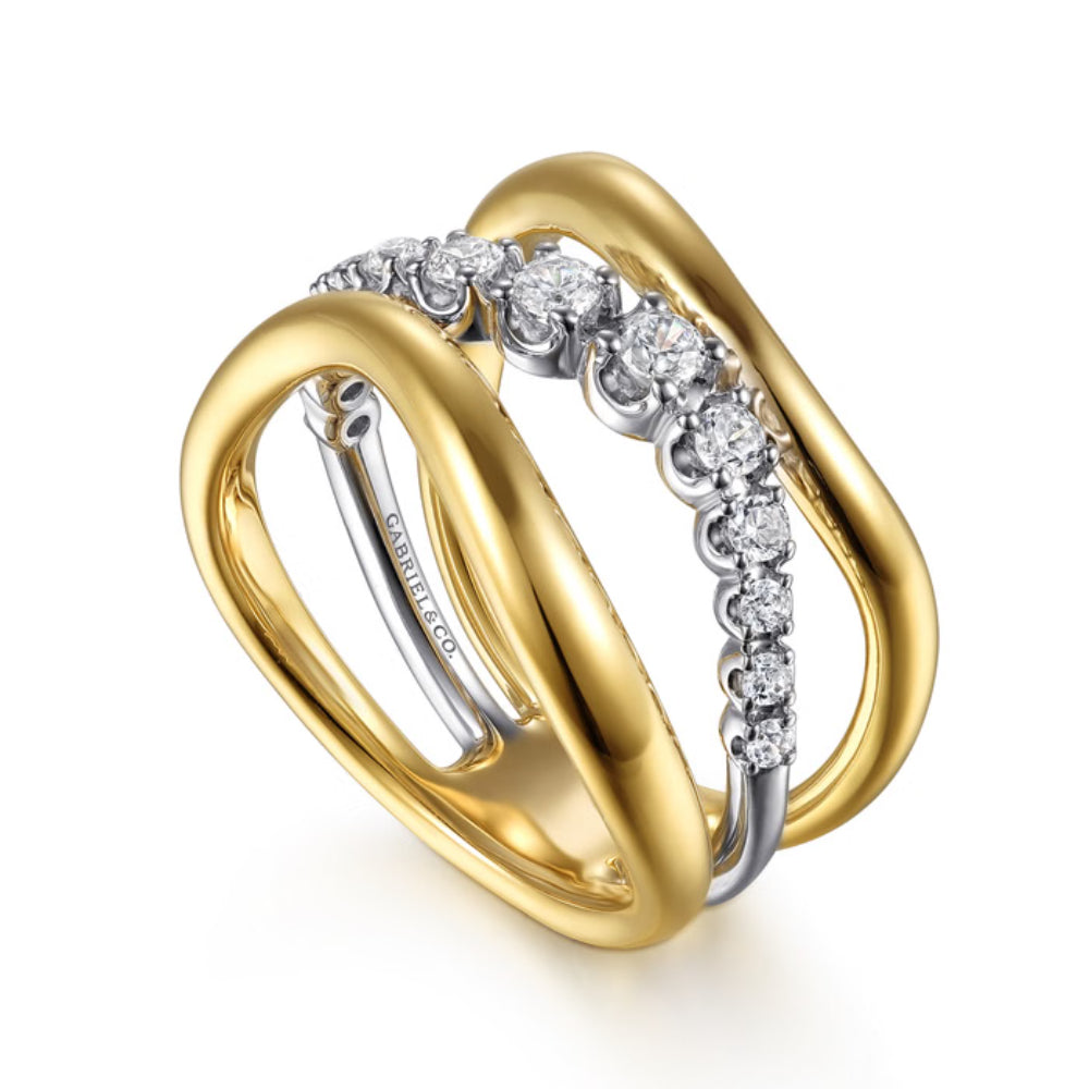 A two-tone double-band ring featuring polished yellow gold and silver bands, with a central channel set with round diamonds. The brand name 'CAROLINA CO.