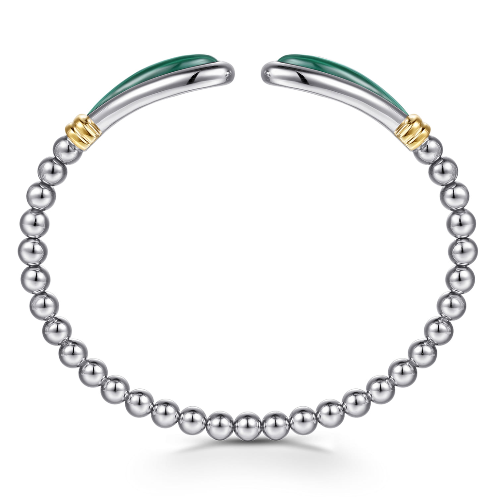 Silver bracelet with green accents and gold elements on a white background