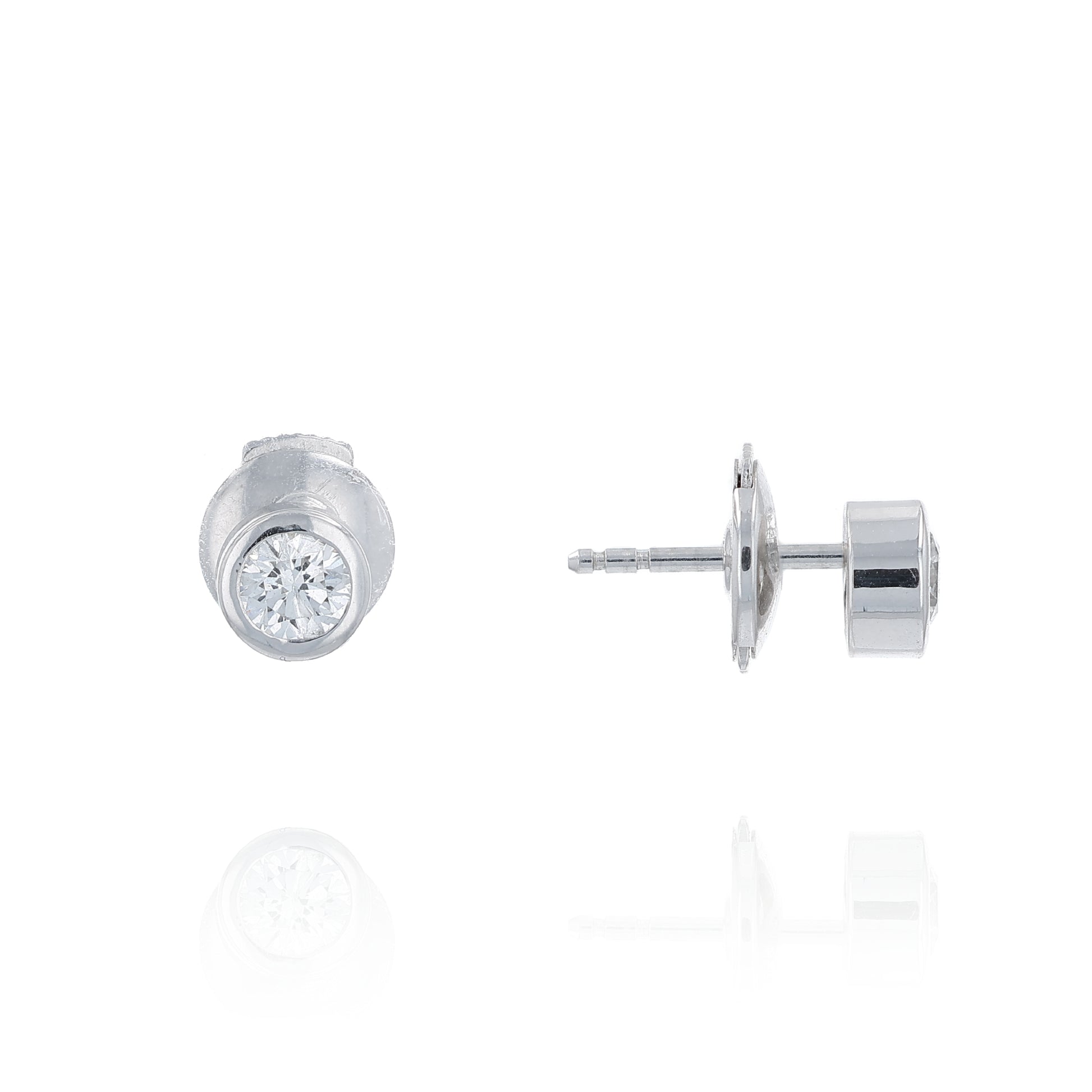 White gold bezel-set diamond stud earrings on a white background