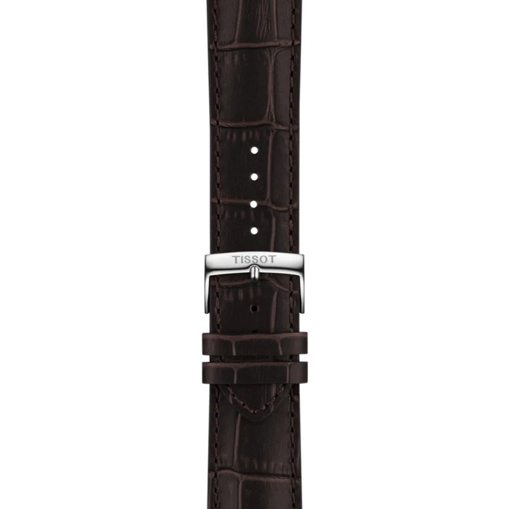 Brown alligator-patterned watch strap with Tissot logo on a white background