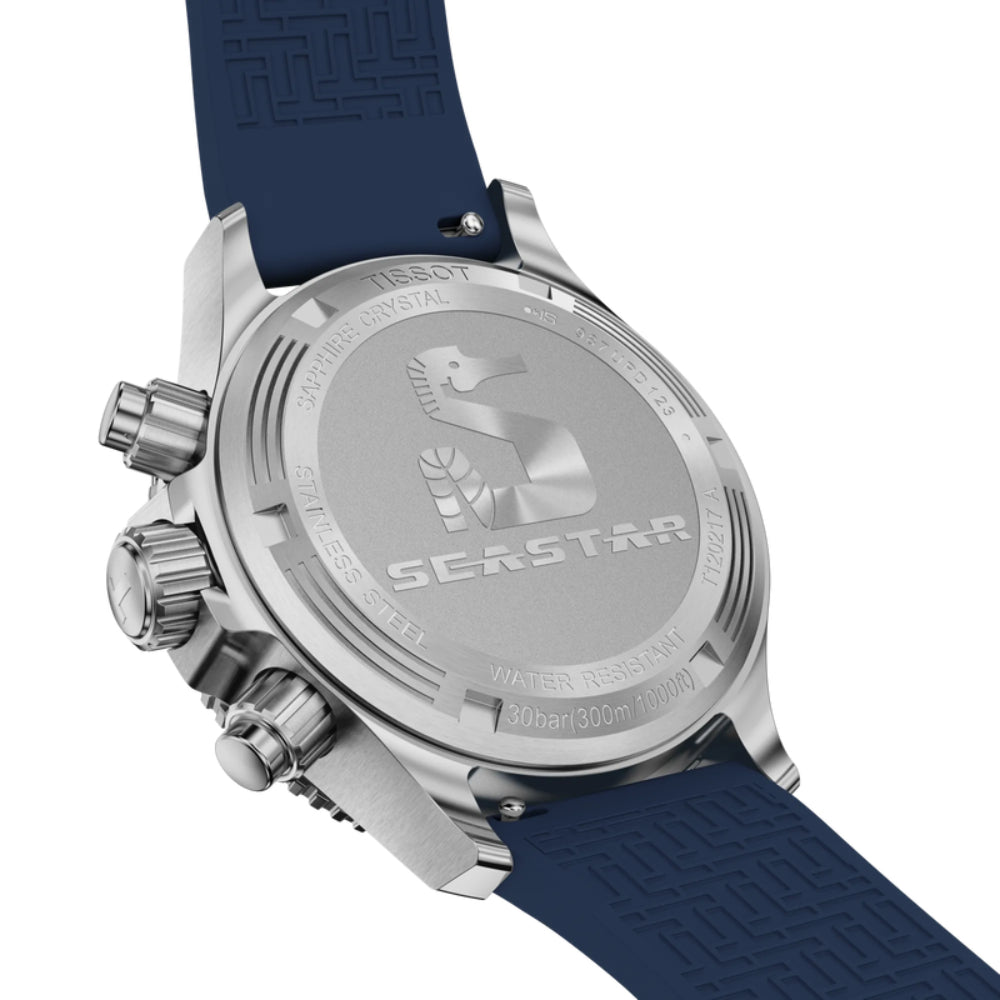 Close-up of a watch with a blue strap and silver case on a white background
