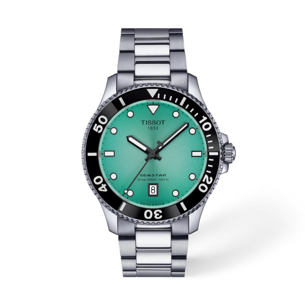Tissot watch with turquoise face and silver bracelet on a white background