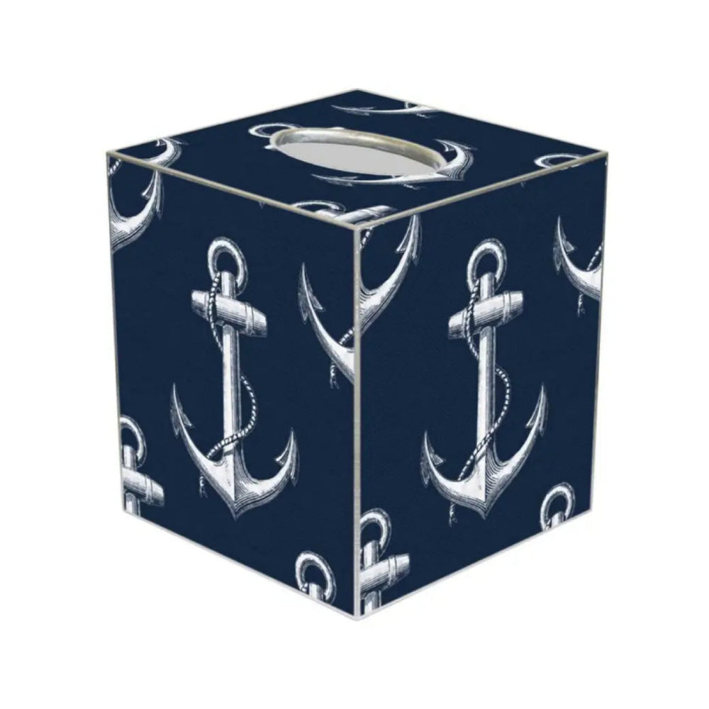 A navy colored cube shaped paper mache tissue box cover with vintage white anchor pattern on a white backround 
