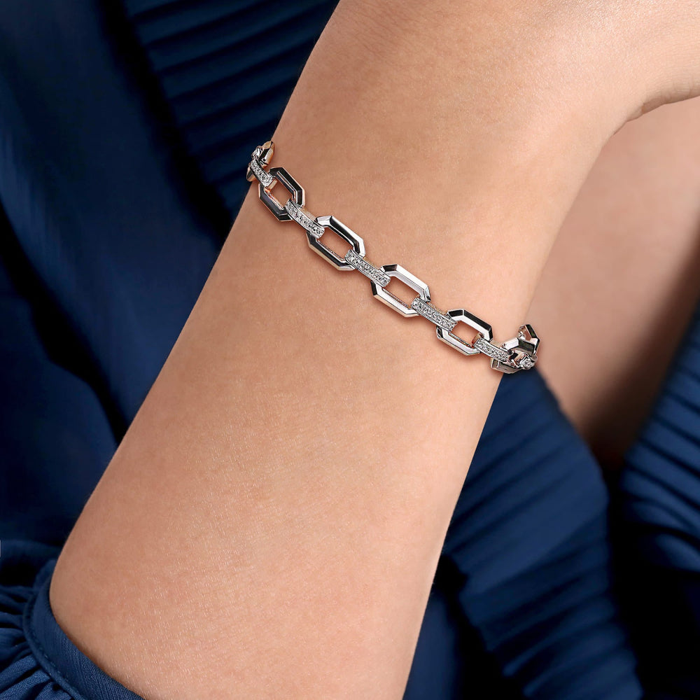 Woman wearing white sapphire link chain bracelet