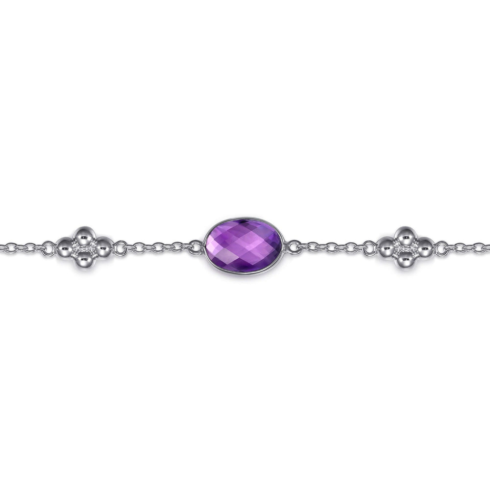 Up close of amethyst in the siiver bracelet 