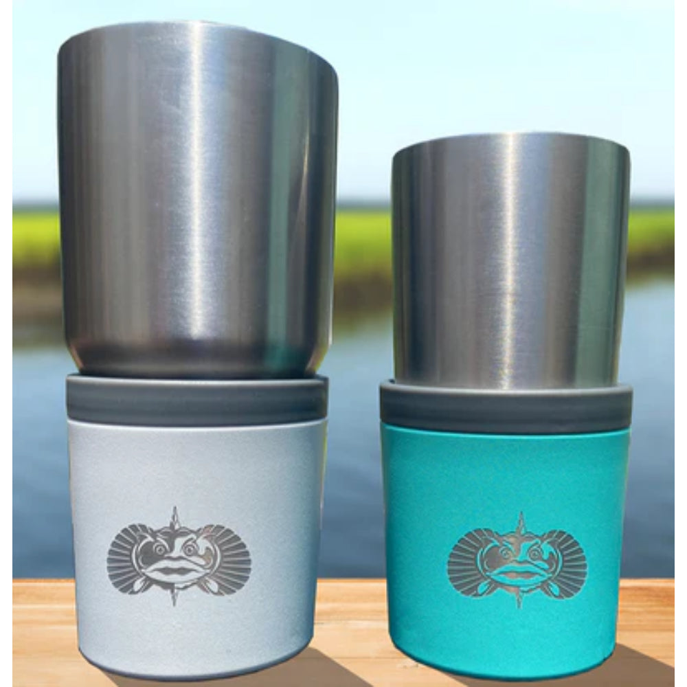 Two stainless steel tumblers in a teal & white cup holder wooden surface with a blurred natural background.
