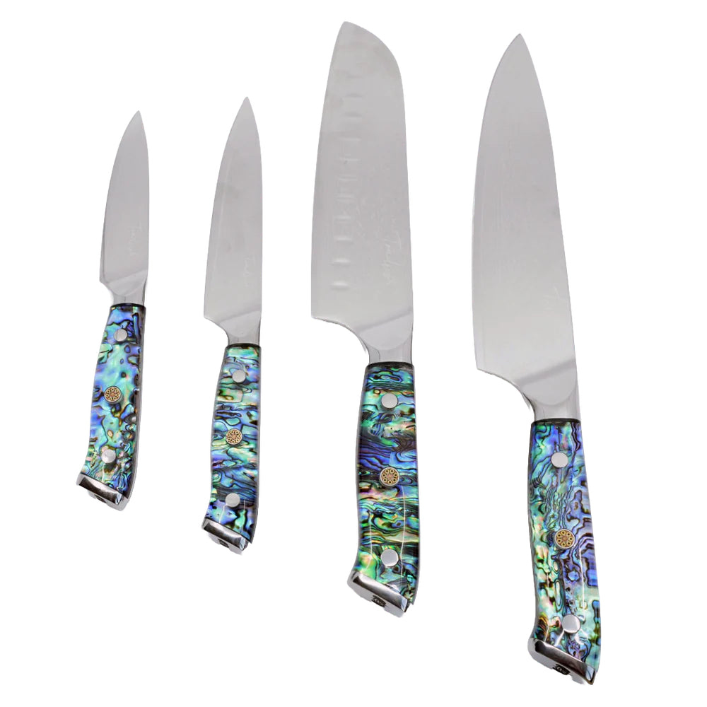 Set of four knives with decorative handles on a white background.