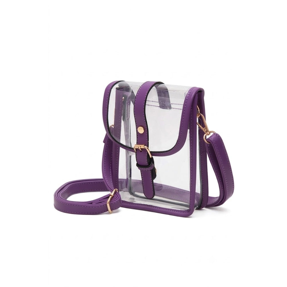 A clear plastic crossbody bag with purple faux-leather trim, a matching purple adjustable shoulder strap, and gold-tone hardware, shown on a plain white background.