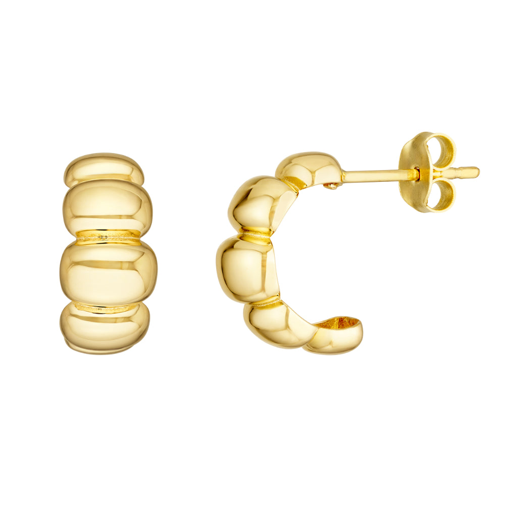 gold tone puffy hoop earrings on white background