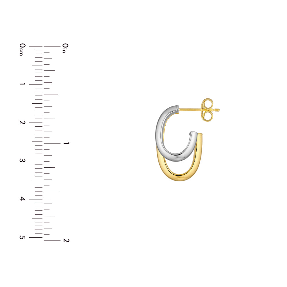 silver and gold tone single hoop earring on white background next to scale