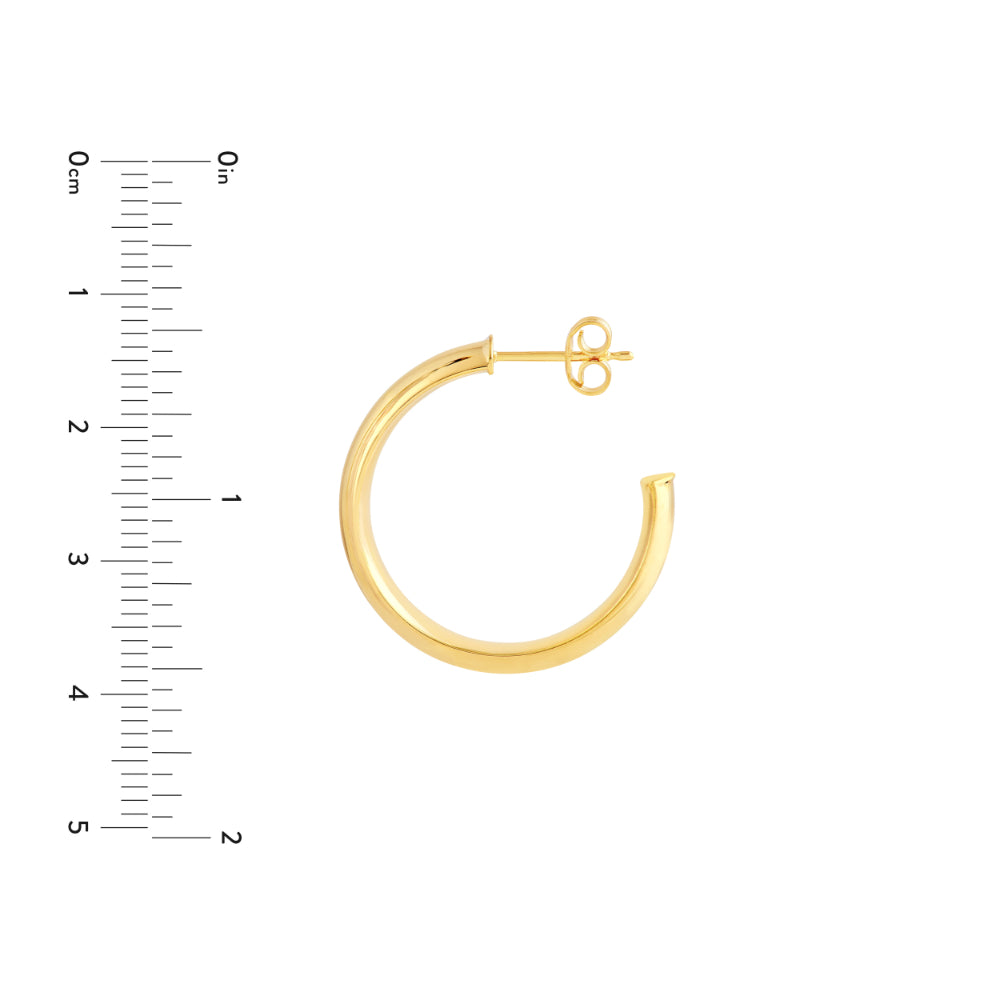 gold hoop earring from side next to scale on white background